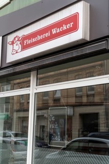 Closed butcher's shop on Ückendorfer Straße, business closed, sign in shop window Die Wurst ist