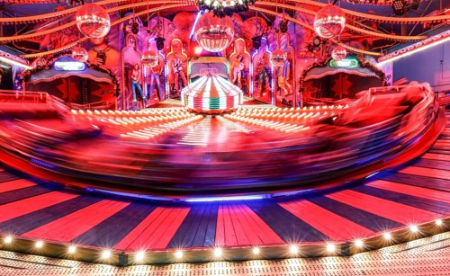 Visitors ride in a Musik Express ride, Berlin, 09.12.2022