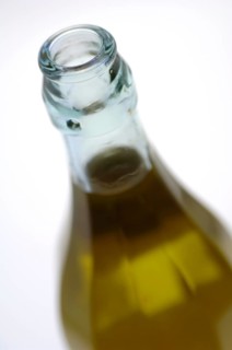 Bottle with olive oil in detail