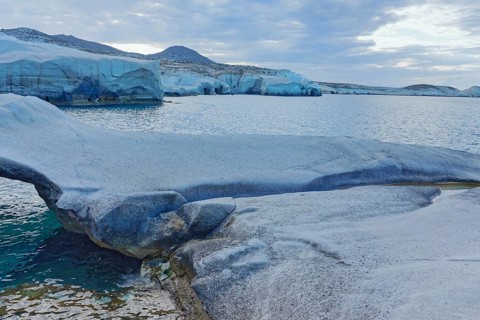 Rock formations and stone bridge, Sarakiniko, Milos Island, Greece, Europe