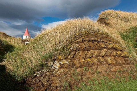 Grass sod houses and church tower, peat farm or peat museum Glaumbaer or Glaumbær, Skagafjörður,