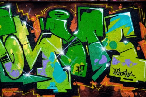 Colourful graffiti with dominant green and orange colours, Landau, Rhineland-Palatinate, Germany,