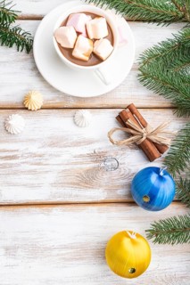 Christmas or New Year frame composition. Decorations, box, balls, cinnamon, ribbons, fir and spruce