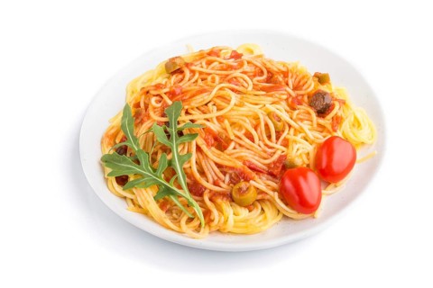 Corn noodles with tomato sauce and arugula isolated on white background. Side view, close up
