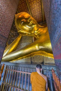 Reclining Buddha with praying monk in Wat Pho temple, Buddhism, religion, world religion,