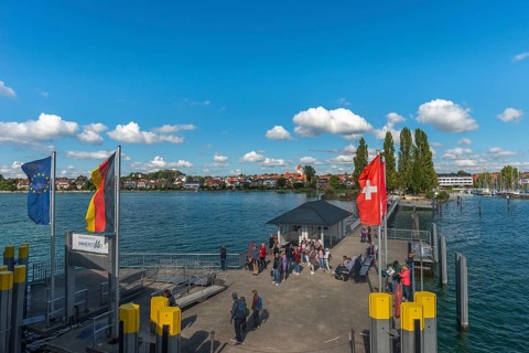 Immenstaad on Lake Constance, townscape, jetty, flags, name plate, blue sky, Baden-Württemberg,