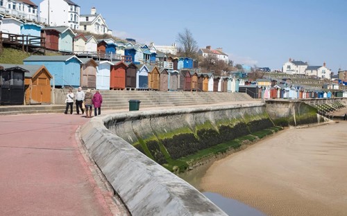 Sea wall, beach and beach huts, Walton on the Naze, Essex, England, United Kingdom, Europe