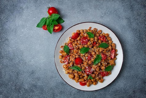 Tuscan pasta with smoked paprika and basil, parmesan cheese, Italian traditional cuisine