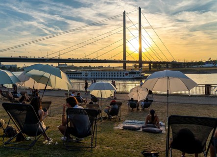 The city beach on the Rhine near Düsseldorf, riverside promenade, by the Rheinkniebrücke bridge,