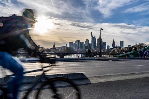 Skyline of Frankfurt am Main, skyscrapers, cyclists on the Flößerbrücke, Hesse, Germany, Europe
