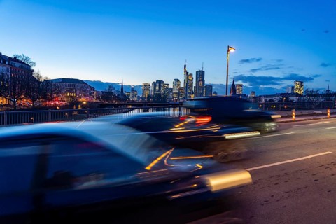 Skyline of the city centre of Frankfurt am Main, road traffic, car, on the raft bridge, dusk, river