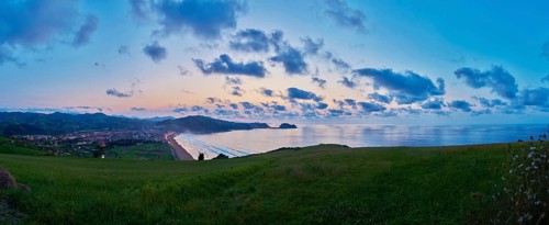 Sunset at the Atlantic coast in summer on the way to Zarautz at the Camino del Norte, coastal path,