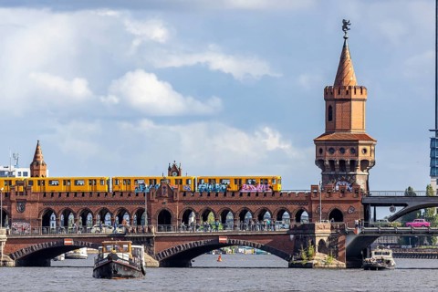 Oberbaum Bridge with underground and pink Trabbi, connection between the districts of Kreuzberg and