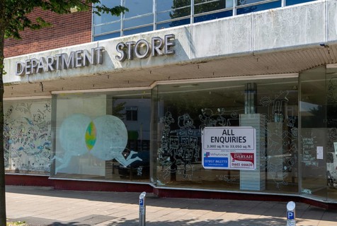 Closed Westgate department store shop with All Enquiries estate agency sign, Lowestoft, Suffolk,