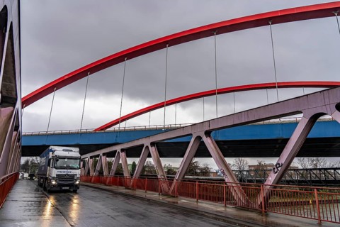 Dilapidated A42 motorway bridge (red arches) over the Rhine-Herne Canal, with massive structural