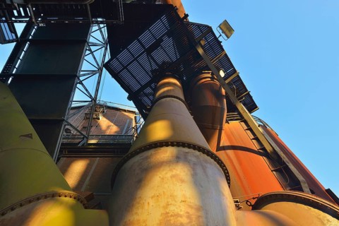 Metal industrial plant with old pipes and steel structures showing traces of rust, Landschaftspark