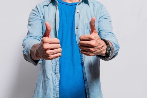 Person hands with thumbs up doing ok, Close up of man hands doing thumbs up, People with thumbs up