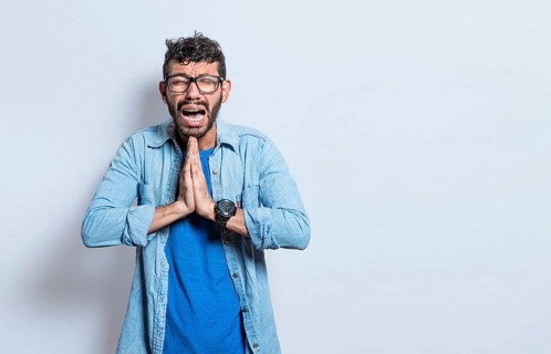 Man worried asking please, People putting hands together asking please, worried man apologizing,