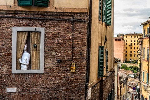 Sculpture in window, figure, gaze, looking, doll, art, representation, old town, alley, Siena,