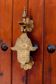Traditional door knocker in hand shape, door fitting, door, brass, hand, entrance, knocking,