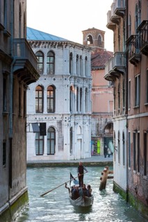 Gondola with tourists in the side canal of the old town, old building, city trip, holiday, travel,