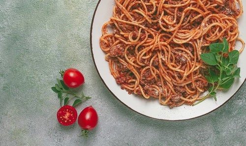 Spaghetti bolognese, in a frying pan, top view, homemade, no people