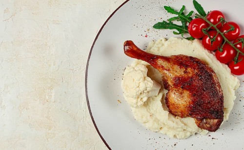 Fried duck shank, cauliflower puree, cherry tomatoes, homemade, no people