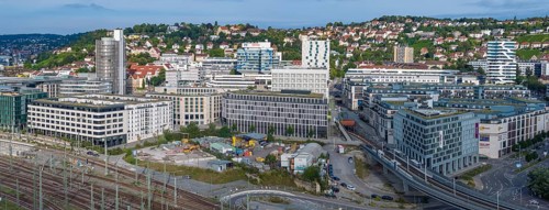 Track apron at Stuttgart main station with the functional buildings of the Europaviertel, the