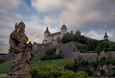 View from the old Main bridge to the statue of St Kilian, in the background Marienburg fortress,