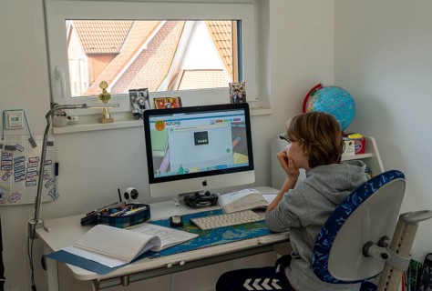 Young, primary school pupils, home learning, doing schoolwork, distance learning, virtual