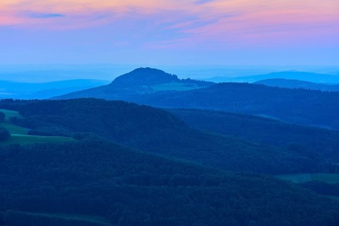 A calming mountain landscape at dusk with soft blue tones and a romantic horizon, Milseburg,