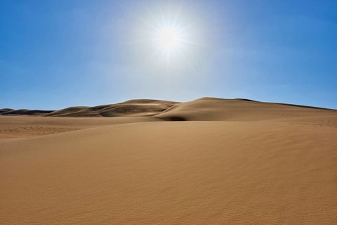 Sunny desert landscape with sand dunes under a clear blue sky, Matruh, Great Sand Sea, Libyan