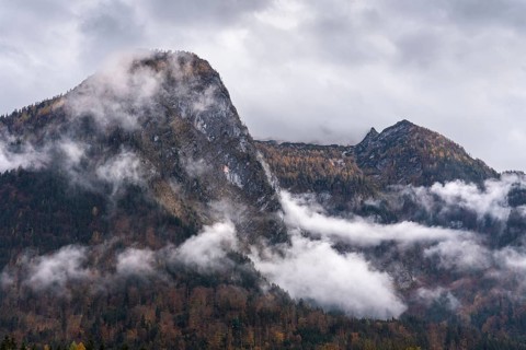 View of part of the Tennengebirge from Oberscheffau. The mountains are covered in clouds. Autumn.