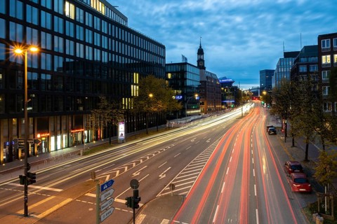 View from Rödingsmarkt to Ludwig-Erhard-Straße and the main church St. Michaels (Michel) at blue