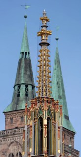 Spire of the Beautiful Fountain, behind the towers of St Sebald's Church, Main Market Square,
