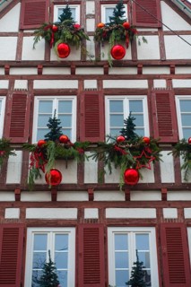 House facade with Christmas decoration, window, window shutters, half-timbered, Christmas motif,