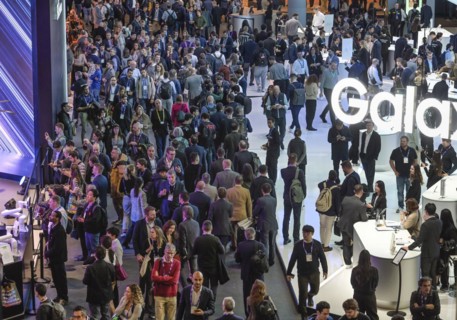 Visitors crowd the MWC Mobile World Congress 2024, Samsung exhibition stand, Barcelona, Spain,