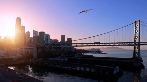 Panoramic San Francisco financial district skyline in city downtown with Oakland Bay Bridge