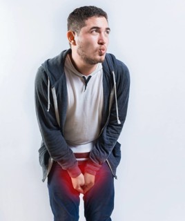 Person with cystitis and urinary problems isolated. Young man with urinary incontinence isolated