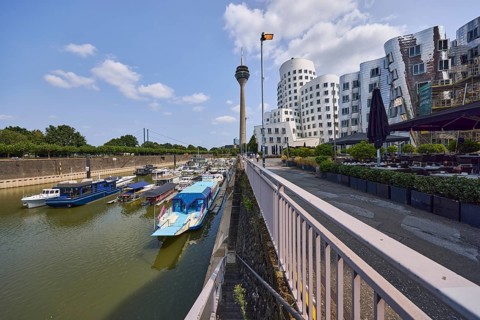Marina, Rheinturm television tower and building by architect Frank O. Gehry in Düsseldorf, state