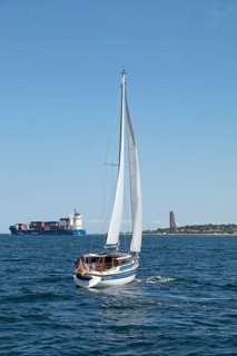 Container ship, sailing boat, naval memorial, Laboe, Schleswig-Holstein, Germany, Europe