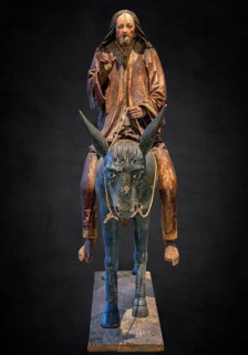 Palm tree donkey, wooden figure from around 1520, on a dark background, Diocesan Museum,
