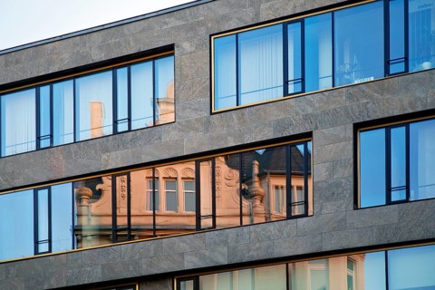 Old architecture reflected in a modern functional building, architectural contrast, Braunschweig,