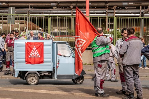 Steelworkers at a demonstration in front of the headquarters of ThyssenKrupp Steel Europe in