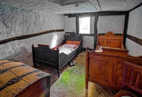 Bedroom of a farm cottage, interior view, open-air museum Klockenhagen, historic Mecklenburg