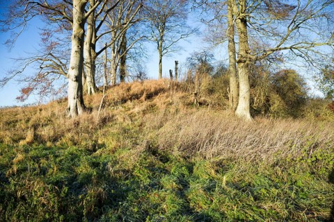 Neolithic long barrow in chalk downland countryside near East Kennett, Wiltshire, England, UK