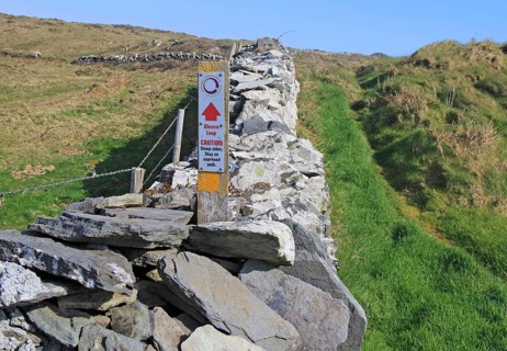Coastal footpath and sign on cliff path, Cape Clear Island, County Cork, Ireland, Irish Republic,