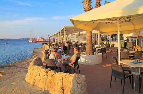 Waterfront cafe restaurant Mellieha Bay resort, Marfa peninsula, Malta, Europe
