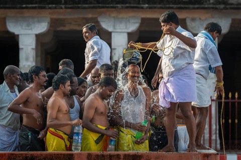 Pilgrims at a washing ritual with 22 stations around the Ramanathaswami temple, a ceremony in which