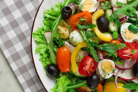 Vegetable salad, with quail eggs and olives, fresh, close-up, no people